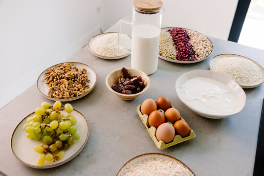 A kitchen table displaying fresh organic ingredients prepared