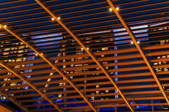 Architectural grid framing skyscraper and city lights