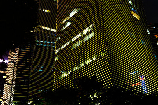 Striped skyscraper in pattern lightning and neon lights
