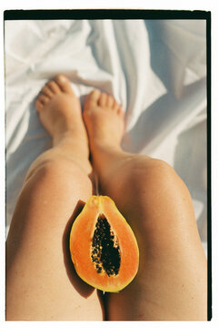 mango split between a woman's legs