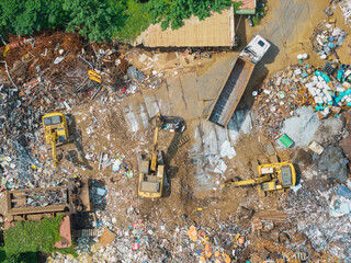 Aerial View Recycling Facility Scrap Yard with Excavators and Tr