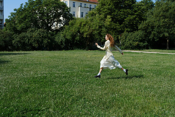 Girl Running Joyfully Through Green Meadow