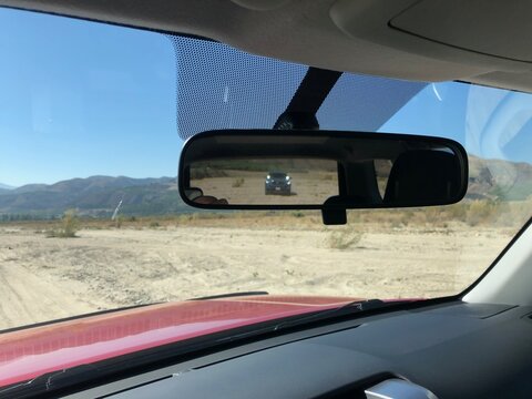 Desert Drive with Truck Behind