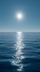 Obraz premium High quality image of sunlight reflected on the ocean surface creating a shimmering path of light.