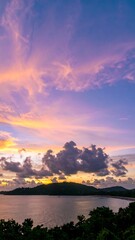 Obraz premium Sunset over a tranquil coastline