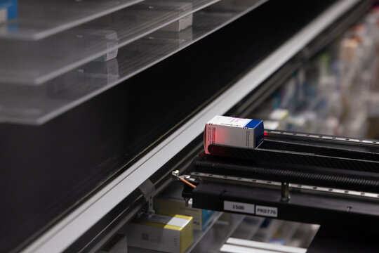 Automated pharmacy conveyor system in action