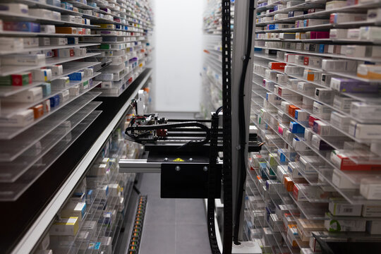 Automated robotic system organizing pharmacy inventory - Powered by Adobe
