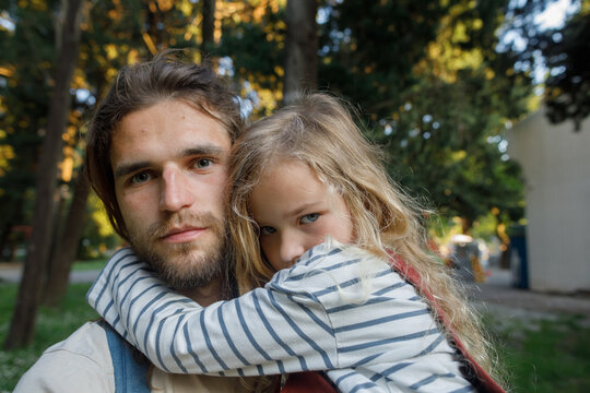 Man and his scowling child