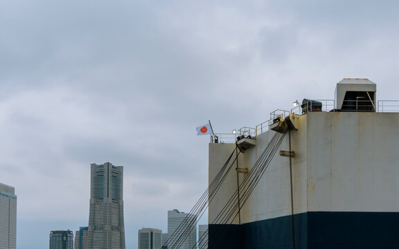 Japanese Flag on a Giant Cargo Ship.