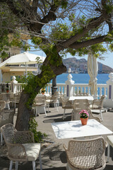 Benidorm, Spain – September 8 2025: Seaside cafe terrace with view of Benidorm skyline in summer sunlight