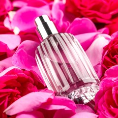 Perfume bottle surrounded by rose petals (2)
