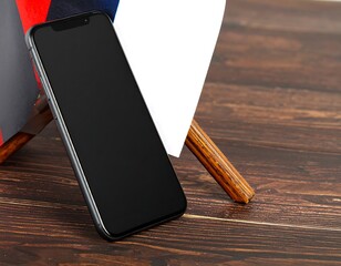 Smartphone resting on wooden floor