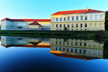 19 century high school reflection in the lake.