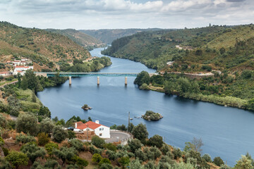Fototapeta premium The Tagus river and road bridge seen upstream from Belver castle in Portugal.