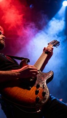 Obraz premium Intense close-up of electric guitar at vibrant rock concert