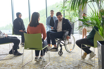 Corporate business team meeting with a manager or coach. Group of happy diverse, multiracial people...