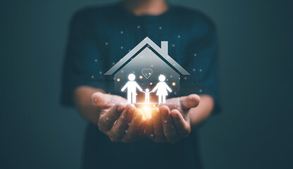 Family insurance concept. Businessman holding family and house icon. Parents and child symbol....