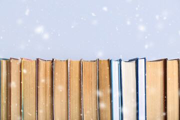 Row of books on grey background