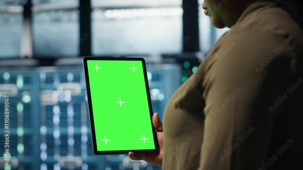 Aufkleber admin with isolated screen tablet in data center implementing advanced power management solutions. e