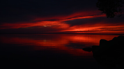 Dark red sunset over water