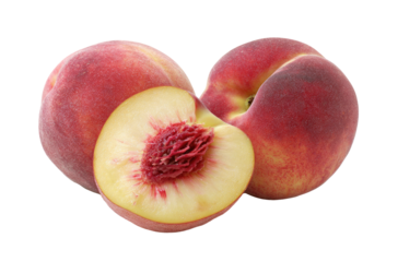 Two peaches, one halved, close-up