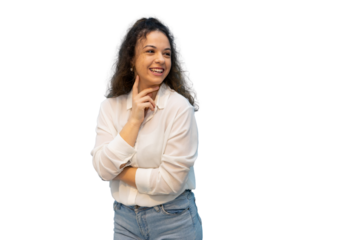 Cheerful curly-haired woman in white shirt and jeans, touching chin and smiling warmly against transparent background during studio photoshoot