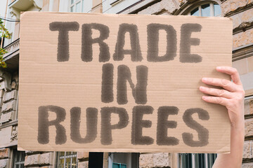 Fototapeta premium “Trade In Rupees” New deals shift old balances. TRADE. RUPEE. DEAL. BALANCE. SHIFT. MARKET. CHANGE.