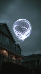 Luminous sphere over house at night
