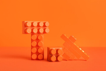 Building blocks on orange table