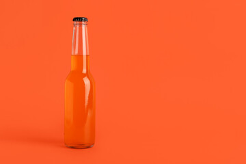 Bottle of soda drink on orange background