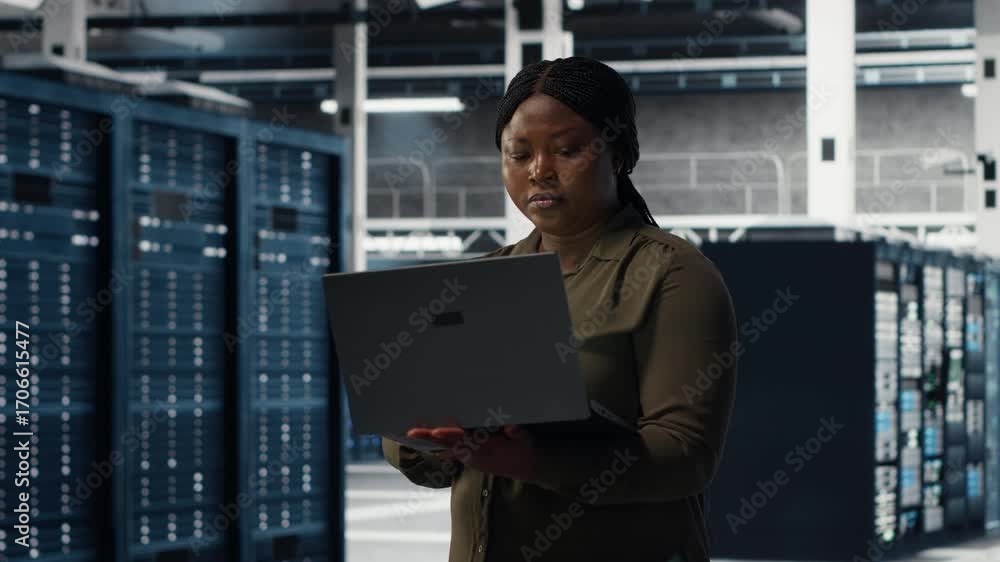 Aufkleber data center engineer using laptop to develop disaster recovery plans, minimizing downtime. server fa