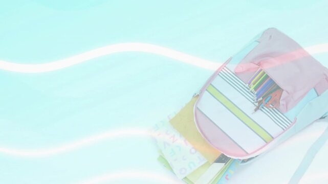 Following pink hint appearing on right, pink backpack sliding inward revealing pencils, notebooks