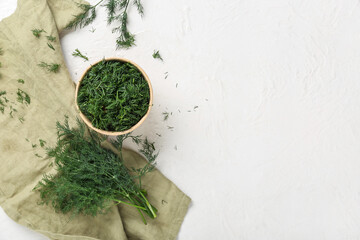 Bowl with fresh green dill on white background