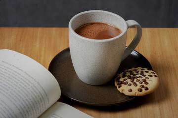 cup of coffee and chocolate cookies