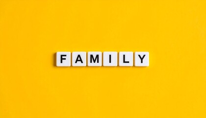 White letter tiles spelling FAMILY on yellow background
