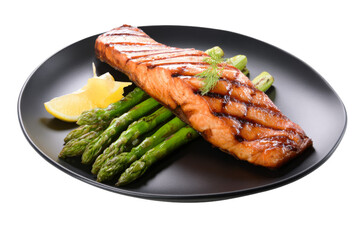 Grilled salmon with asparagus and lemon on black plate