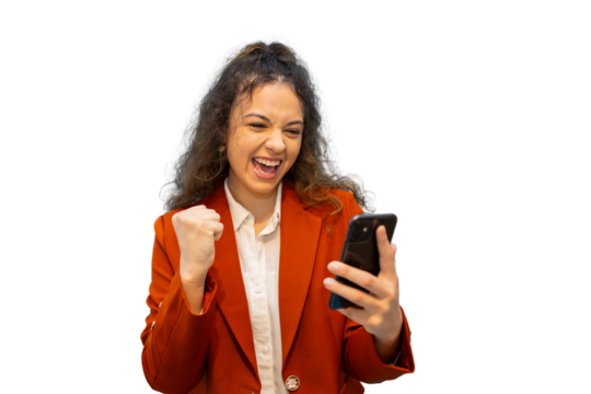 Excited businesswoman raising fist while looking at smartphone, celebrating success with transparent background