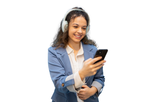 Professional woman listening to music, wearing wireless headphones, working on smartphone against clean white backdrop