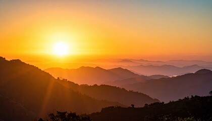 Obraz premium Sunrise over layered mountain ranges