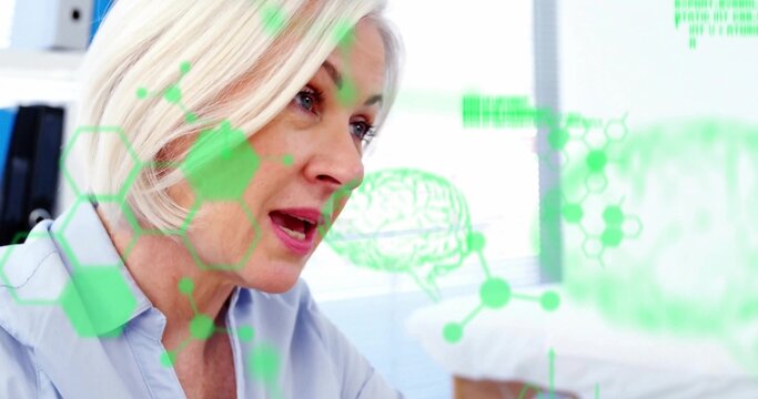 Explaining research wearing blue blouse with green hexagonal and brain overlays at office desk - Powered by Adobe