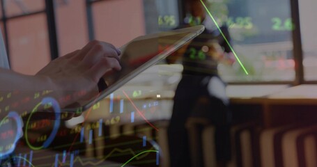 Tapping adult hand navigating tablet on wooden desk near office windows, with stock chart overlay