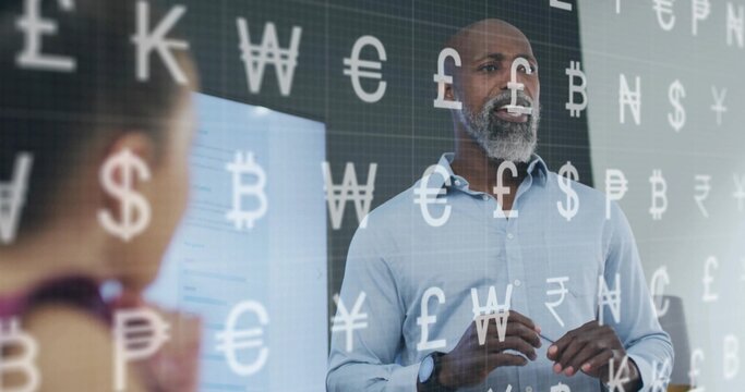 Gesturing presenter in blue shirt pointing at display screen in meeting room, with currency symbols - Powered by Adobe