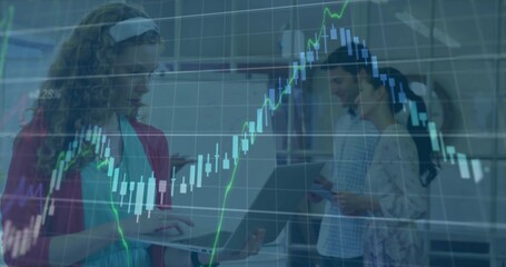 Typing adult woman with turquoise top using laptop in office with stock chart overlaid, copy space