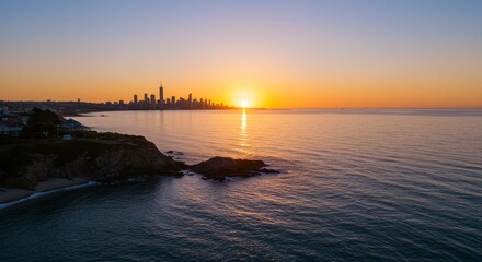 City Skyline at Sunrise Over Ocean Horizon