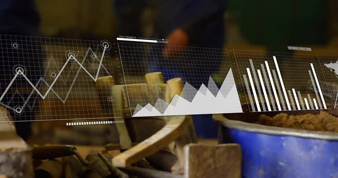 Worker gripping paddle mixing clay for consistency leveling smoothing with charts sliding off frame