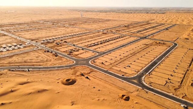 Future urban expansion in arid desert landscapes, showcasing early infrastructure and planned communities