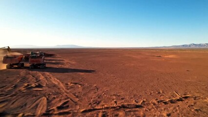 Vast Red Desert Landscape with Mining Trucks - Powered by Adobe