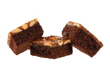 Chocolate brownie cake with nuts on top  isolated on white background.