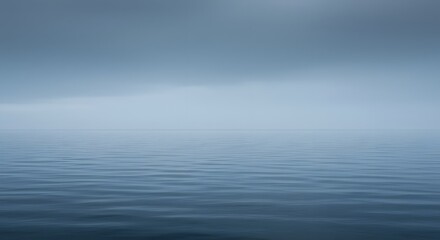 Obraz premium Calm Blue Ocean with Overcast Sky and Gentle Ripples