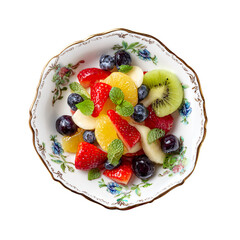 Fresh fruit salad with strawberries, blueberries, oranges, kiwi, and mint leaves, served in a decorative ceramic bowl, top view composition

